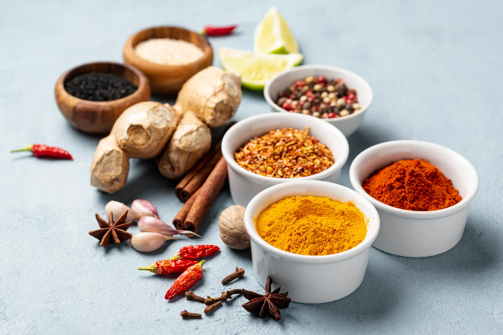 Indian spices — turmeric, chilli powder, ginger, cinnamon, star anise and peppercorns